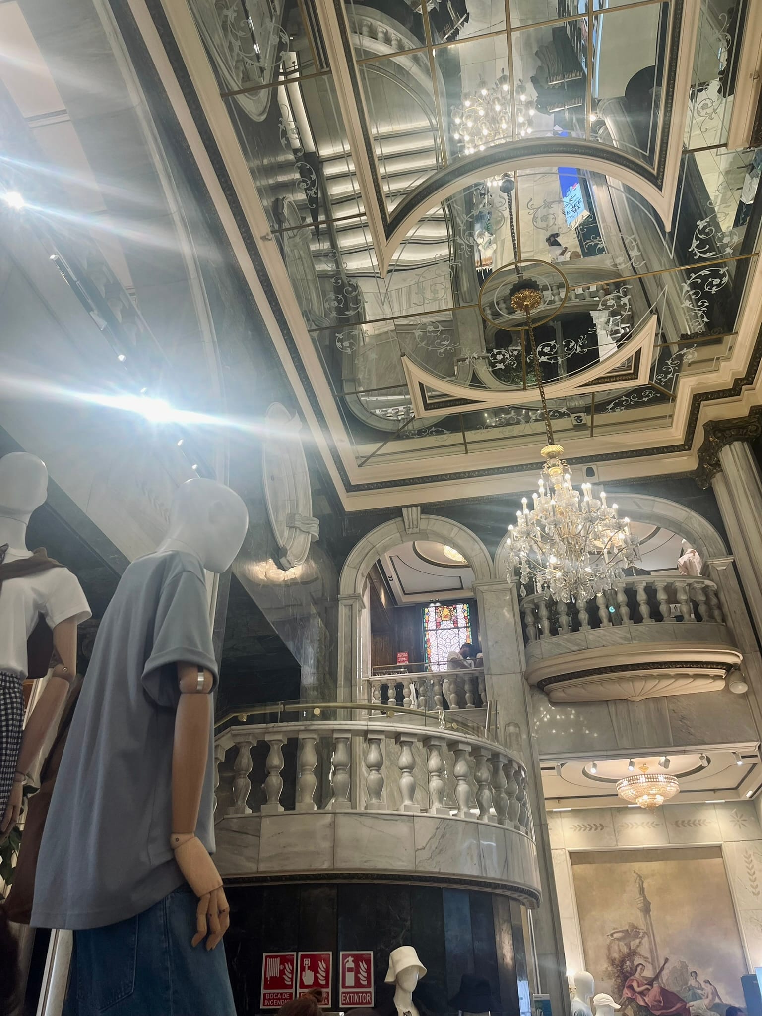 mannequin in a tall, grand building