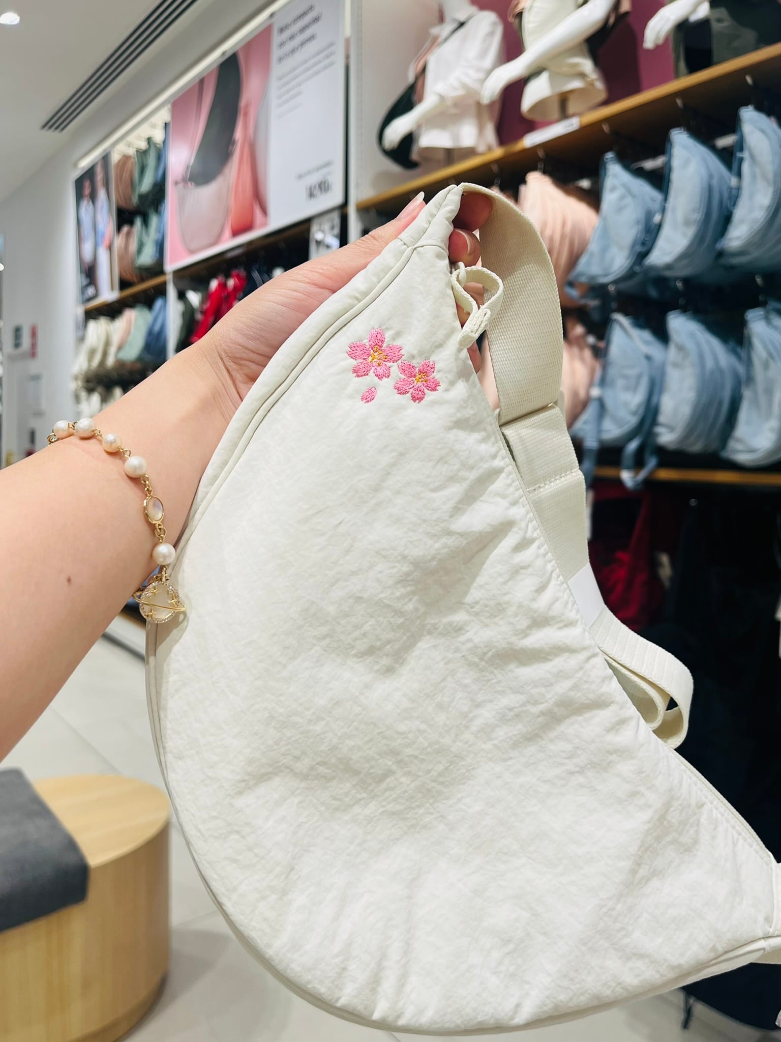 white crescent bag with sakura flower