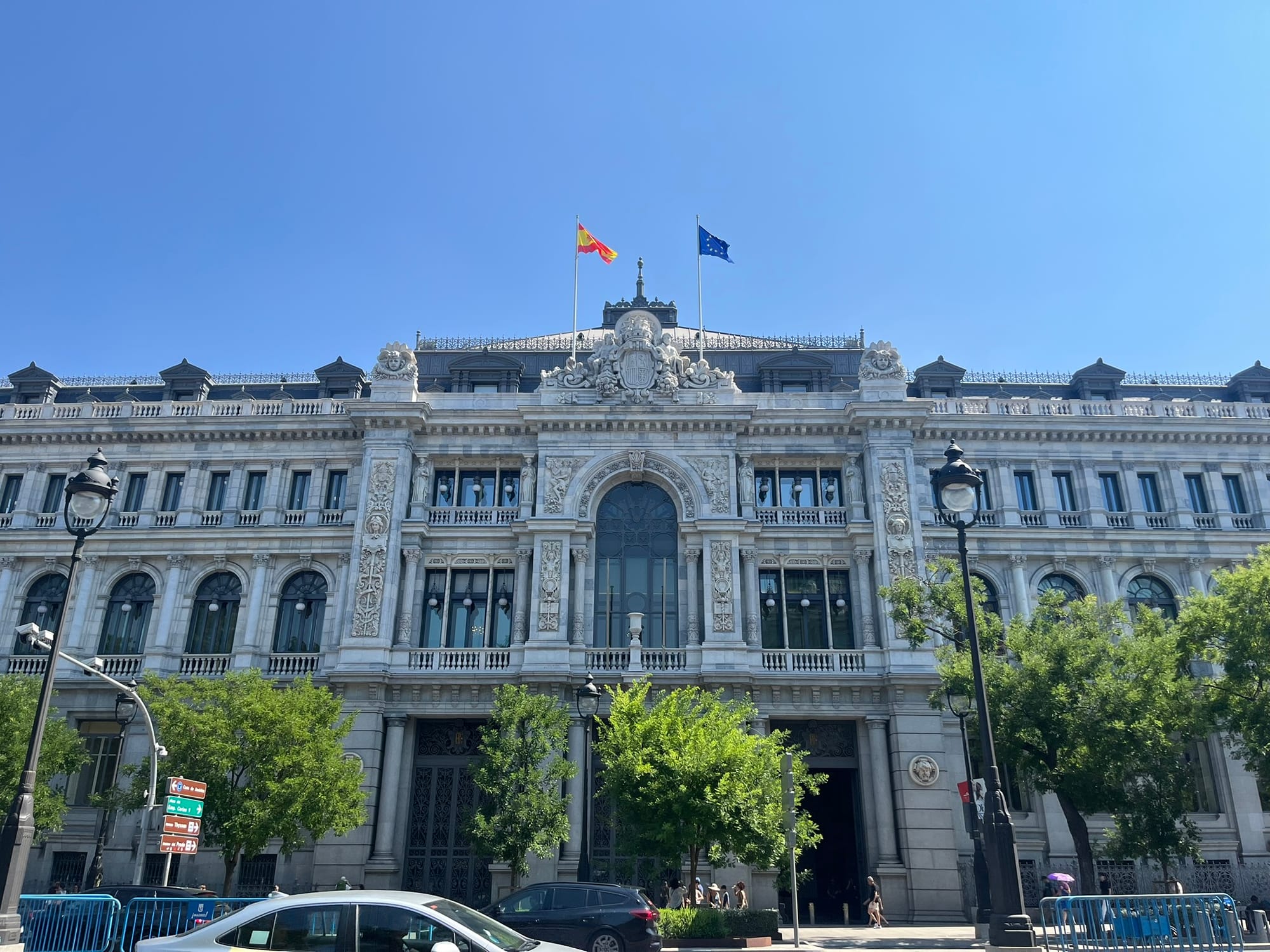 grand heritage building with two flags on top