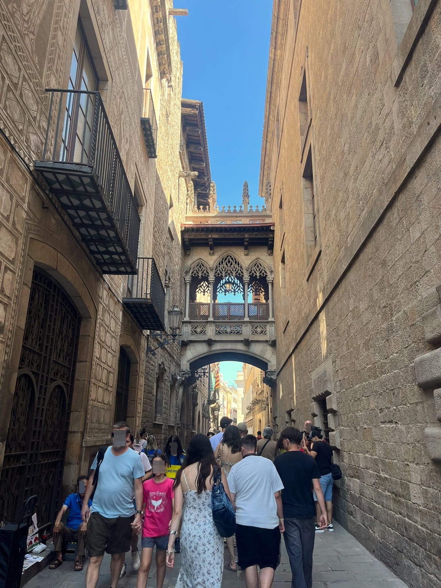 crowd of people in narrow alley