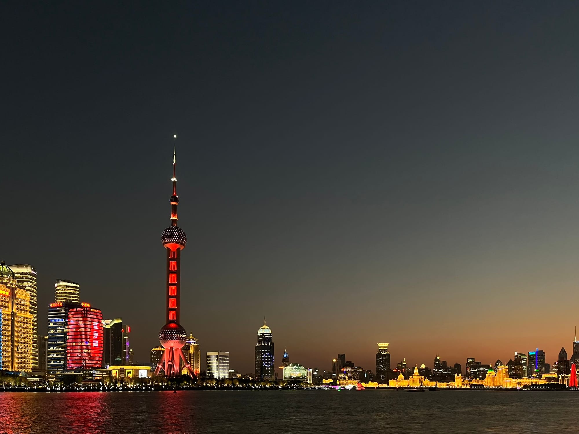 skyline of an urban city, with skyscrapers and a radio tower