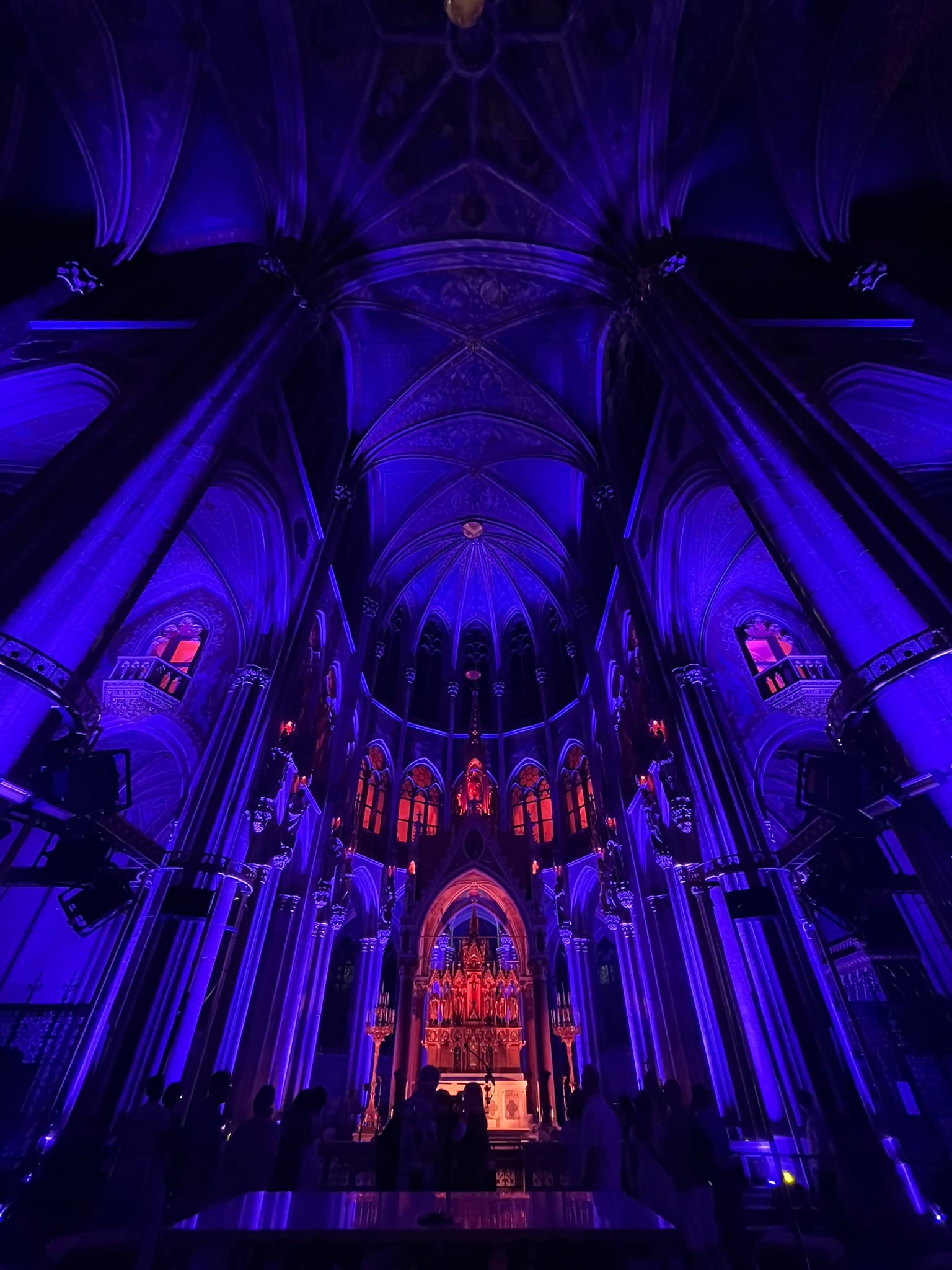 interior of church in deep purple and red light
